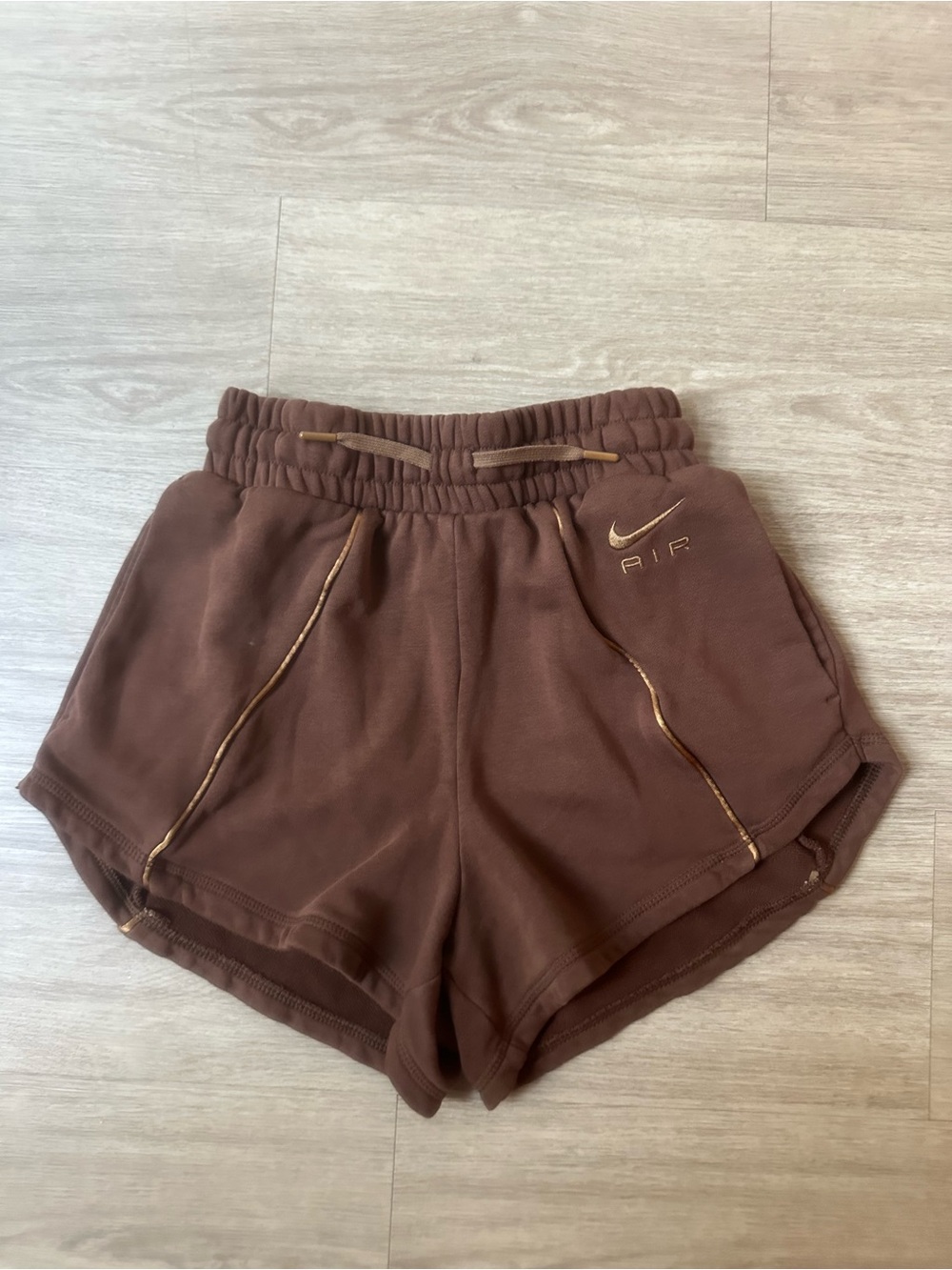 Nike Women’s Brown Athletic Shorts with Gold Accent